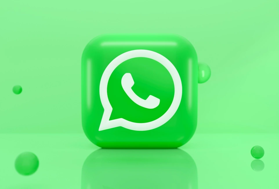 A green 3D icon of a telephone handset inside a speech bubble